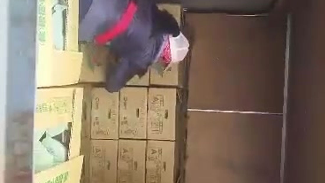 putting package in truck farmer